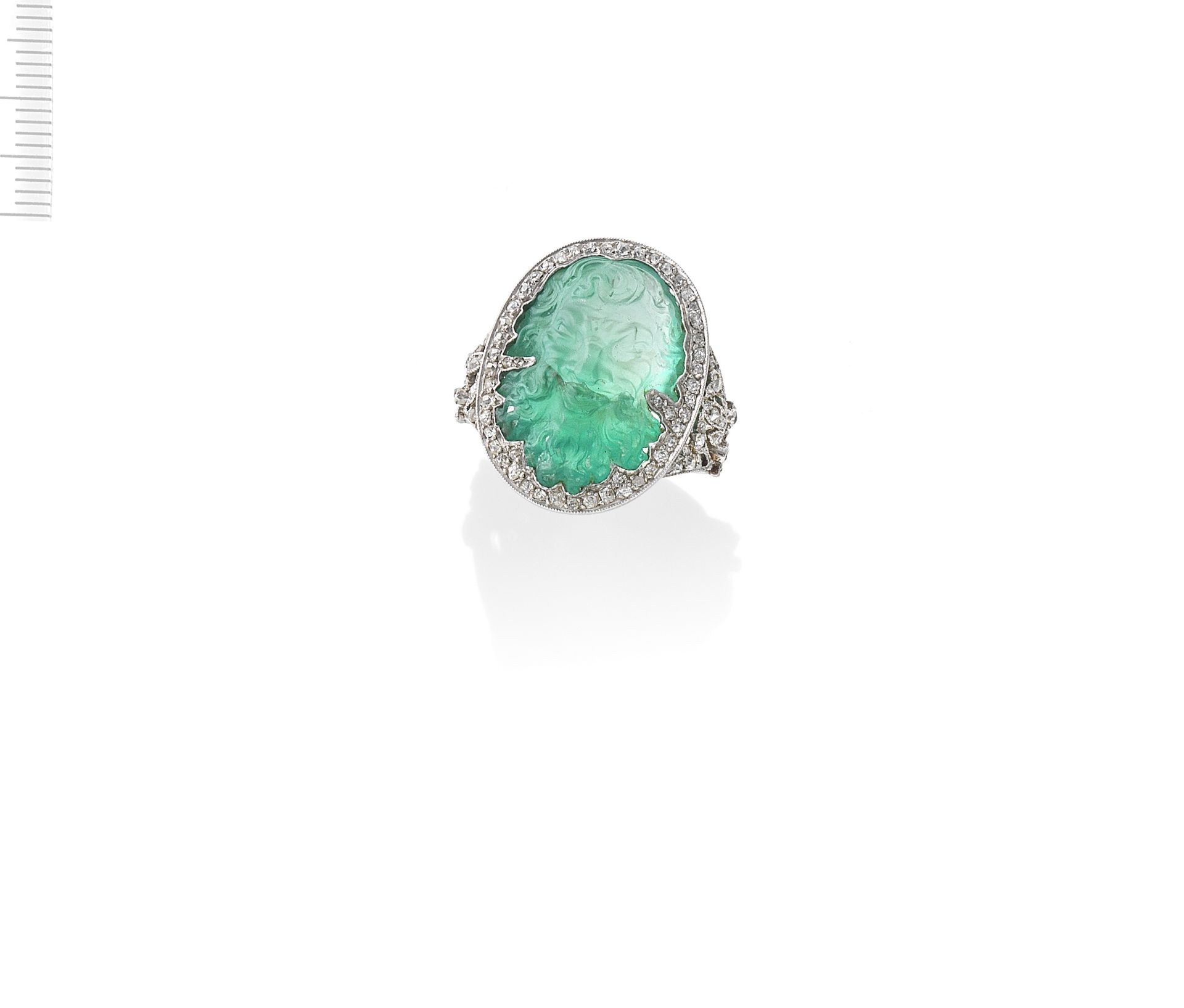 EMERALD CAMEO AND DIAMOND RING, FIRST HALF OF THE 20TH CENTURY