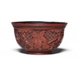 A RARE CARVED CINNABAR LACQUER 'HUNTING SCENE' BOWL 16th/17th century (2)