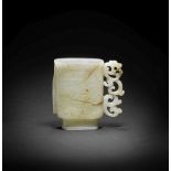 A RARE PALE GREEN AND RUSSET JADE INSCRIBED ARCHAISTIC CUP Ming Dynasty