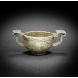 A 'CHICKEN BONE' JADE TWO-HANDLED CUP 16th/17th century (2)