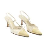 A PAIR OF BEIGE PATENT AND LAMBSKIN KITTEN HEELS Chanel (includes box)