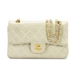 A BEIGE SMALL CLASSIC DOUBLE FLAP BAG Chanel, 1994-96 (includes serial sticker and dust bag)