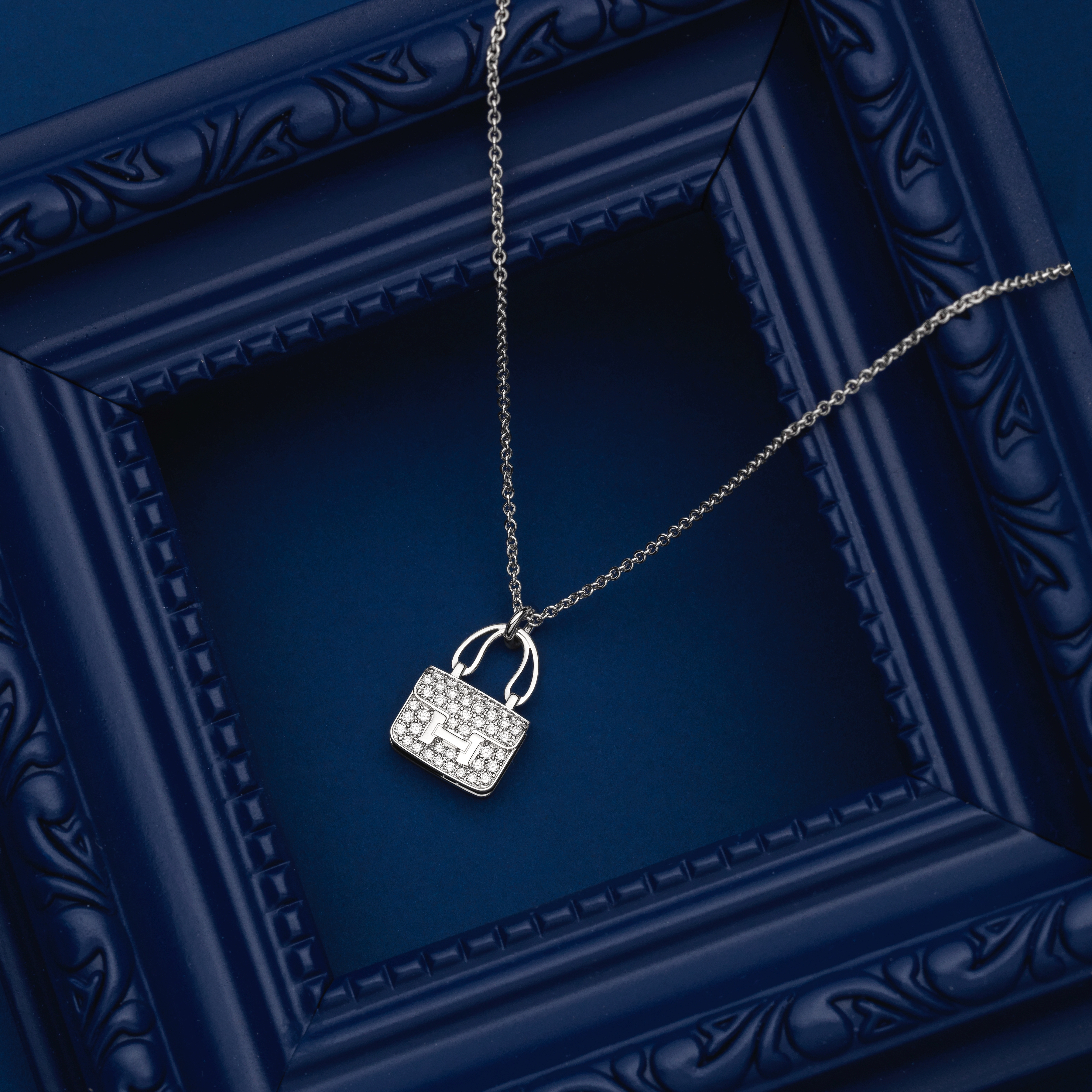 A WHITE GOLD AND DIAMOND CONSTANCE AMULETTE NECKLACE Herm&#232;s, 2021 (includes box and certific...