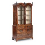 A Queen Anne Walnut and Featherbanded Cabinet-on-Chest