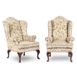 A Pair of George III style mahogany wing armchairs