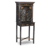 A 19th century Chinoiserie decorated and ebonised small cabinet-on-stand