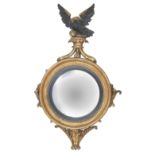 A giltwood and gesso convex wall mirror