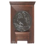 Bronze portrait medallion set within artist's designed wooden frame