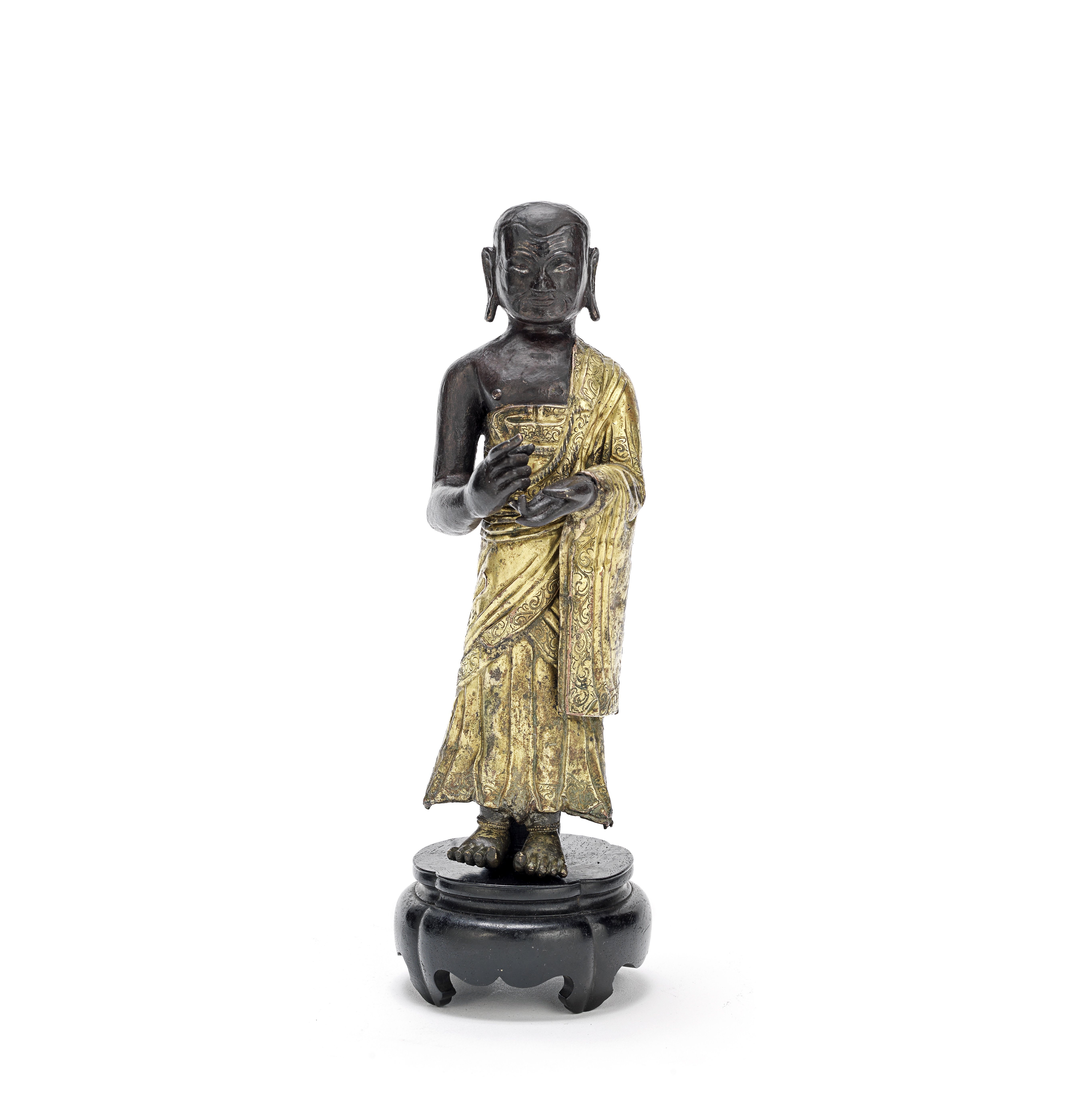 A GILT-COPPER REPOUSS&#201; FIGURE OF A MONK Possibly 18th century (2)