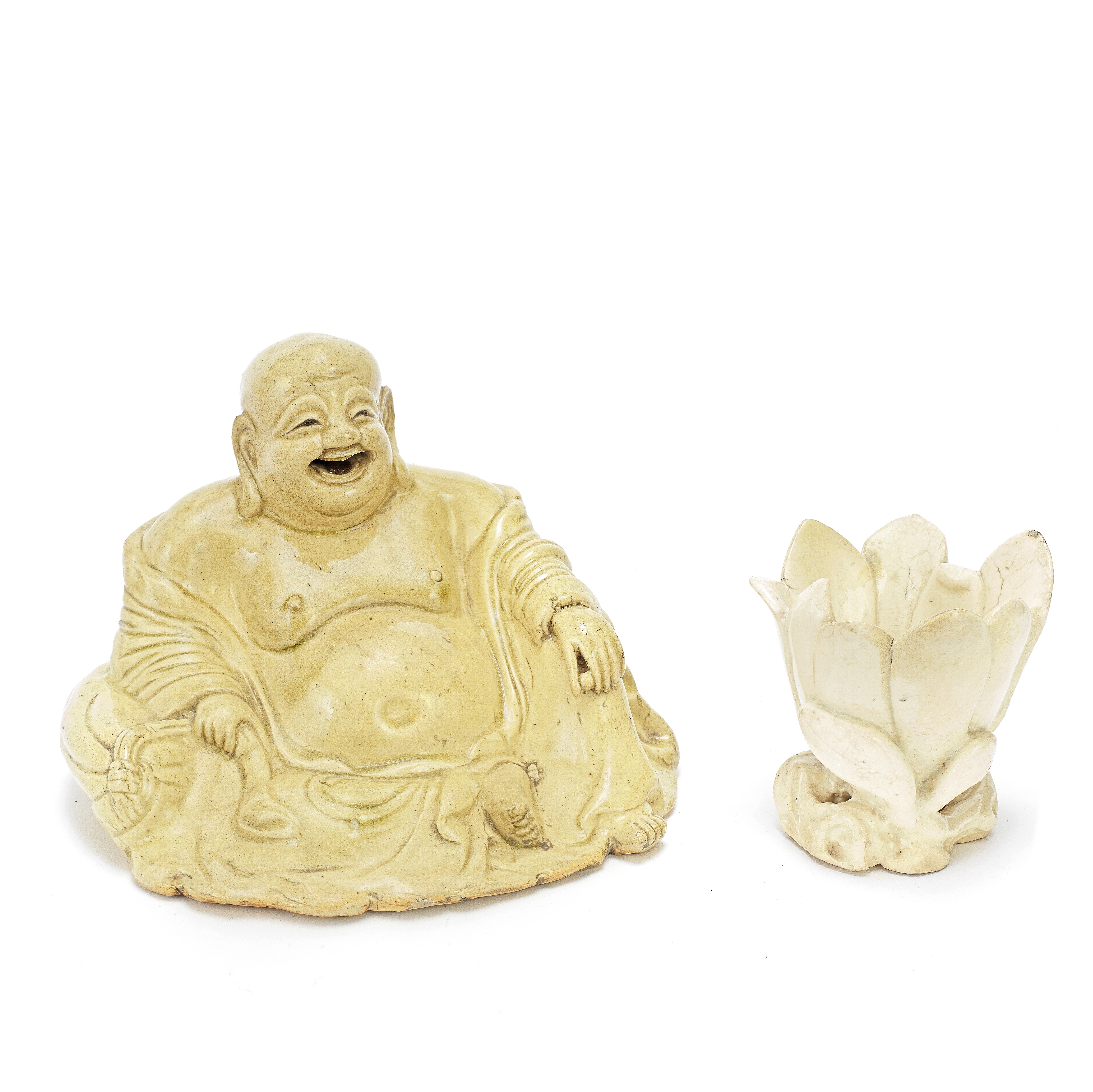 AN YIXING PALE CREAM SLIP FIGURE OF BUDAI AND A ZHANGZHOU WHITE-WARE MAGNOLIA CUP 17th century (2)