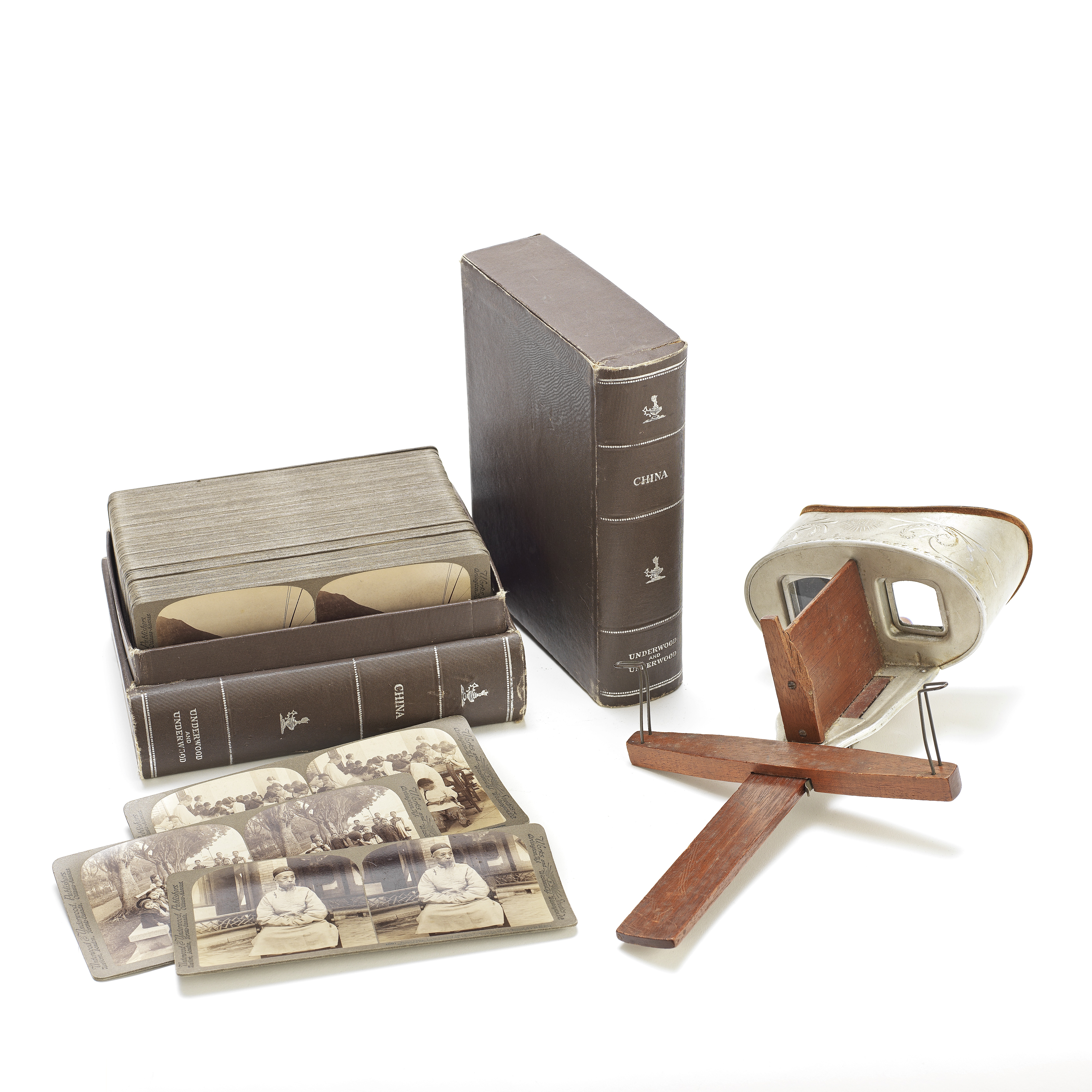 AN UNDERWOOD & UNDERWOOD STEREOSCOPIC VIEWER AND CASED-CARDS WITH PHOTOGRAPHS OF CHINA Circa 1901...