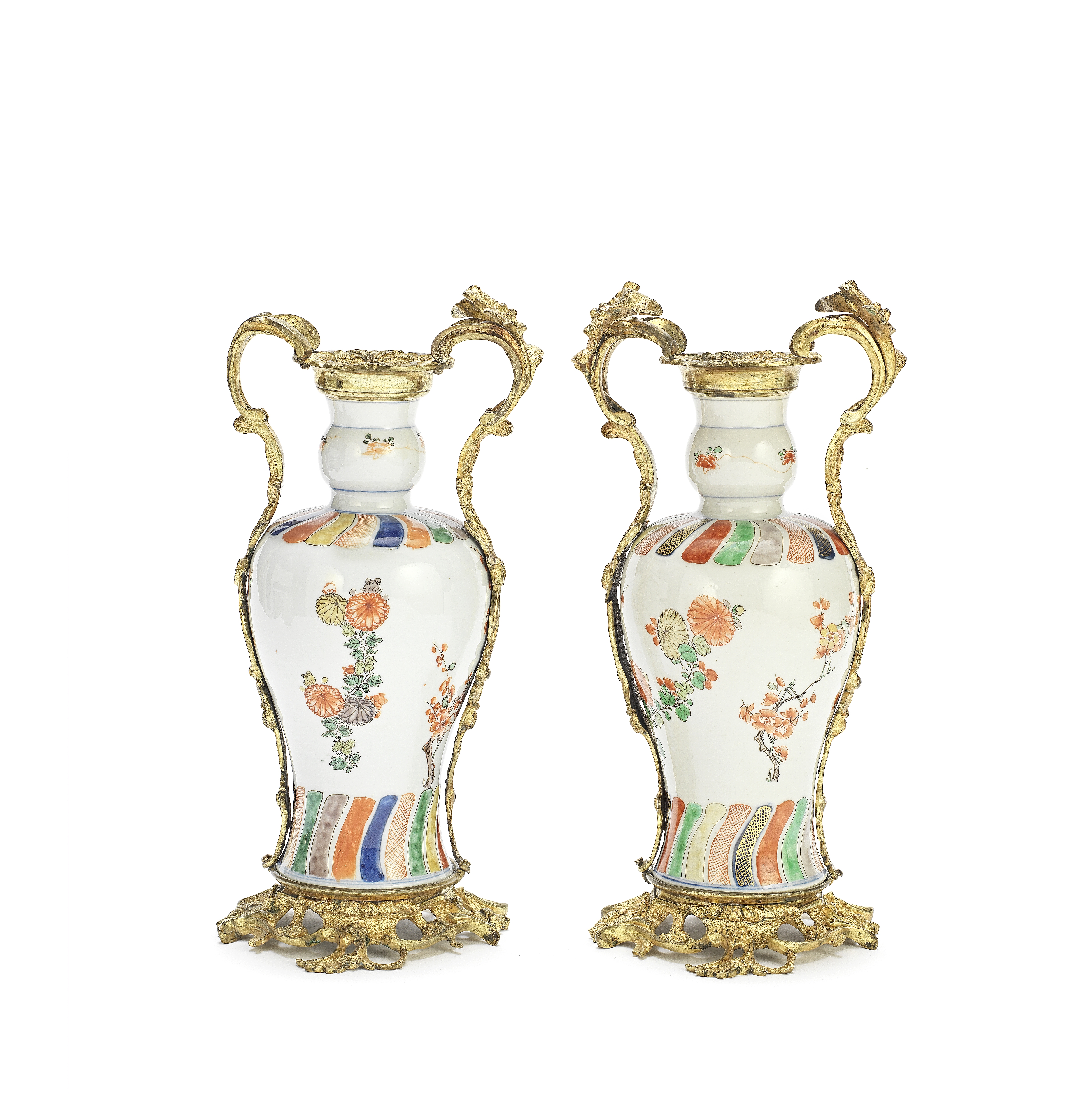 A PAIR OF UNUSUAL UNDERGLAZE BLUE AND ENAMELLED VASES WITH GILT BRONZE ROCOCO-STYLE MOUNTS The po...