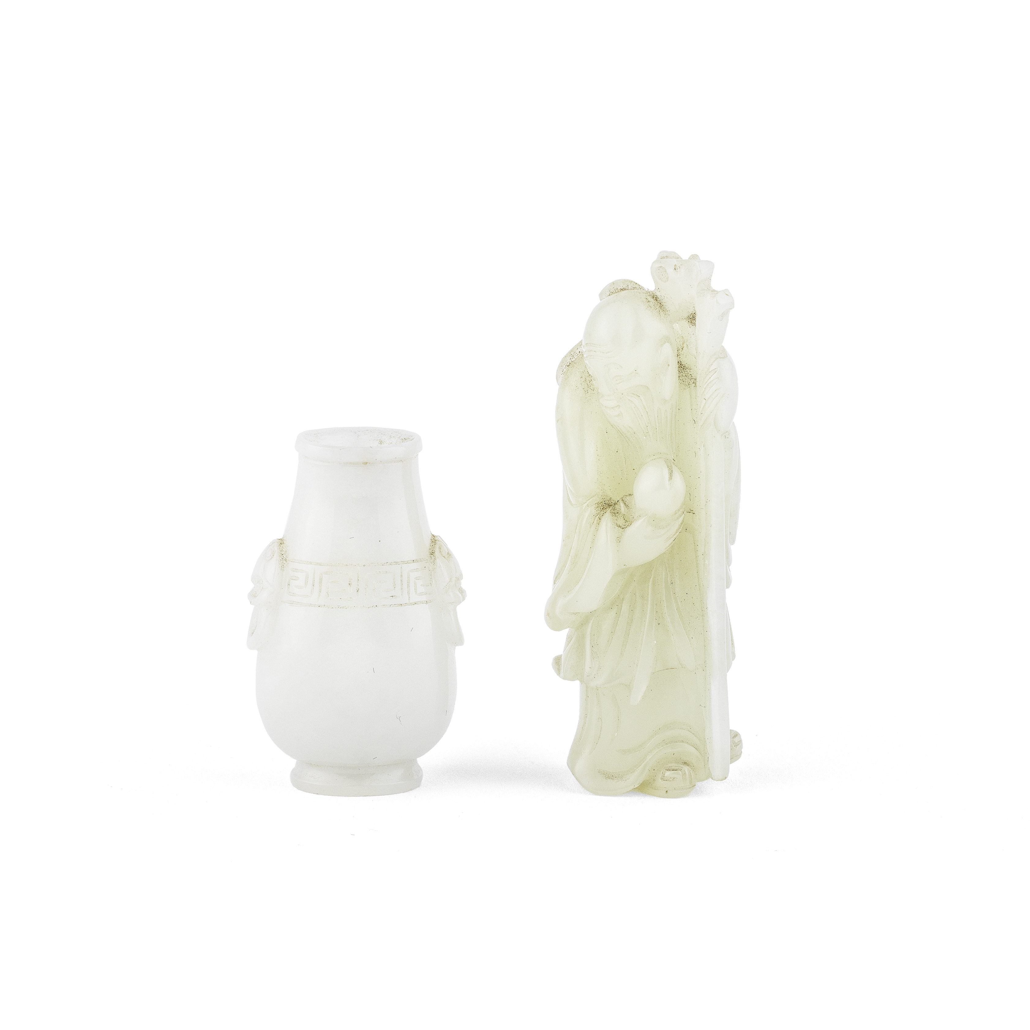 A PALE GREEN JADE FIGURE OF SHOULAO AND A WHITE JADE VASE 18th/19th century (4)