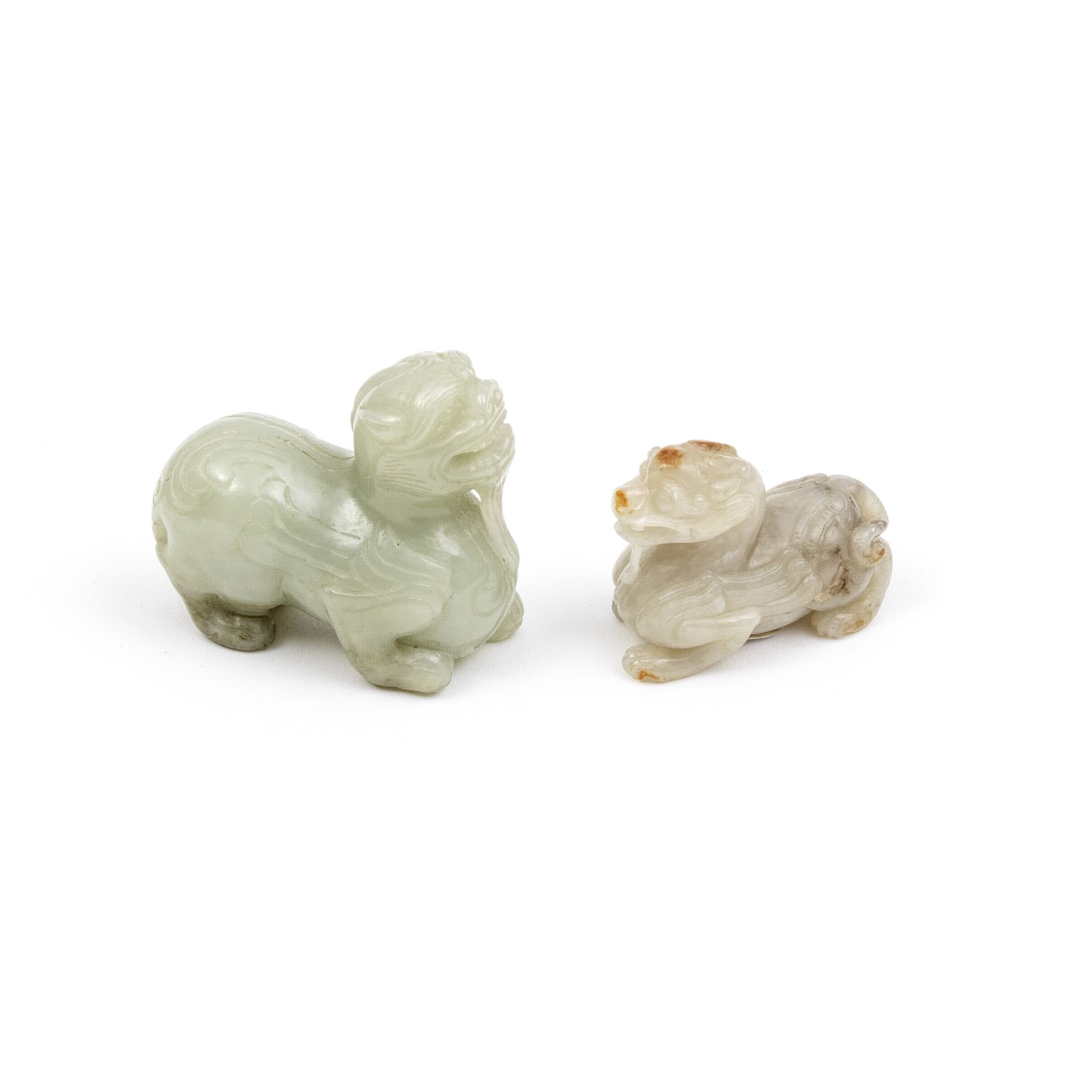 A WHITE AND RUSSET AND A PALE GREEN JADE CARVING OF BIXIE Qing Dynasty (2)