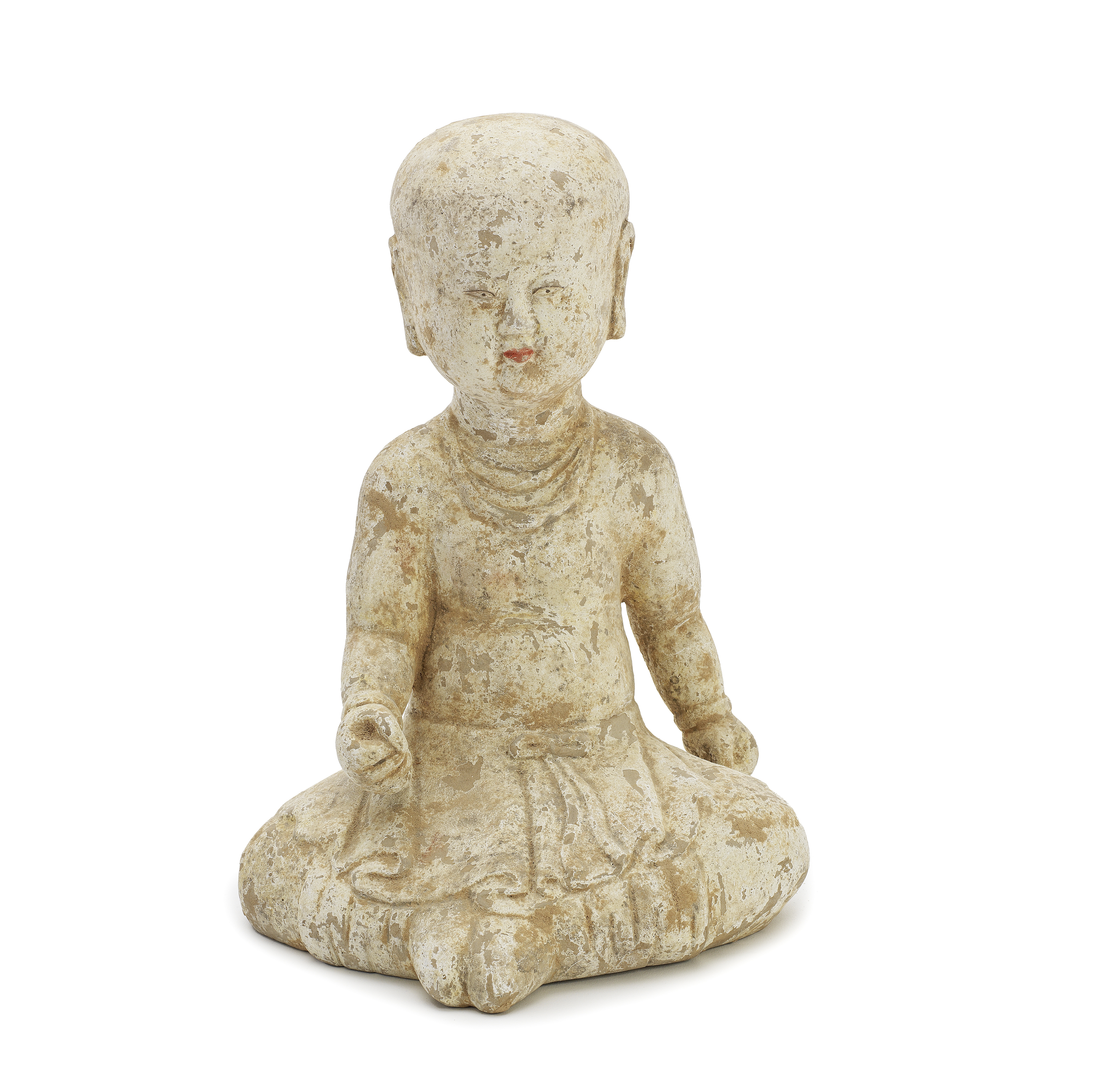 A POTTERY FIGURE OF A NOVICE MONK Tang Dynasty