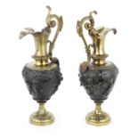 A pair of late 19th century gilt and patinated bronze garniture ewers in the Renaissance revival...