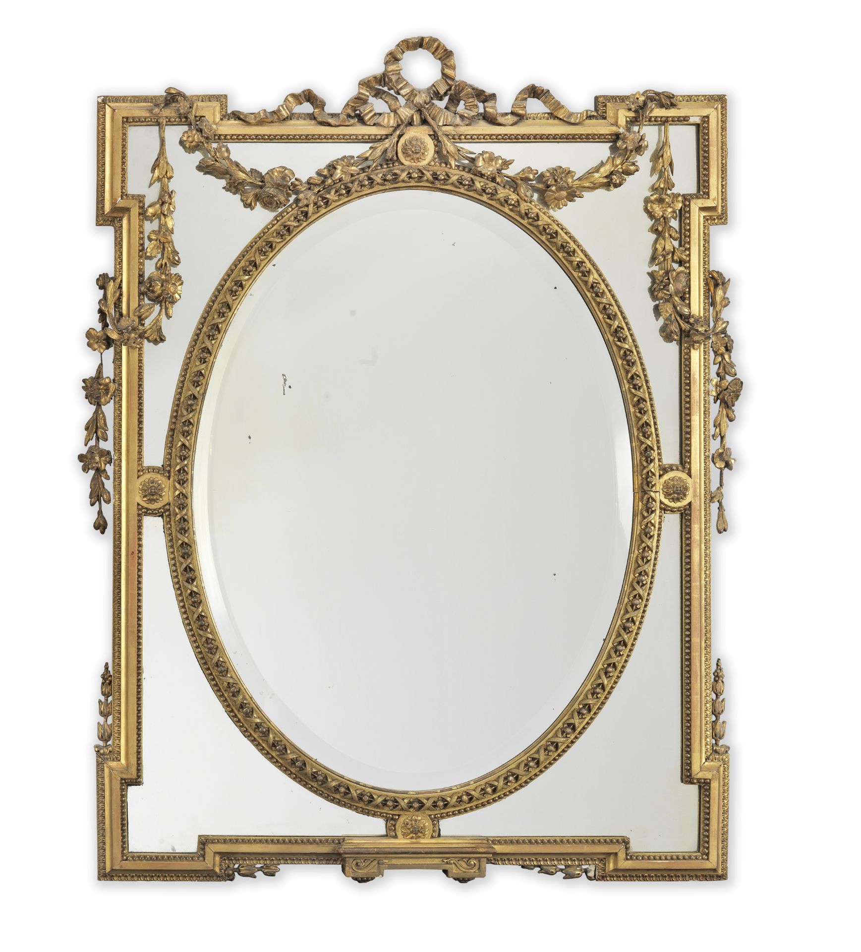 A French late 19th century giltwood and gilt composition marginal mirror in the Louis XVI style