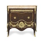 A French early 20th century gilt bronze mounted amboyna and mahogany commode