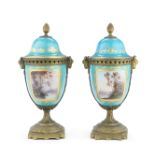 A pair of late 19th Century French gilt bronze mounted S&#232;vres-style porcelain pot pourri vas...