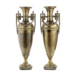 A pair of late 19th / early 20th century patinated and parcel gilt bronze garniture vases in the ...