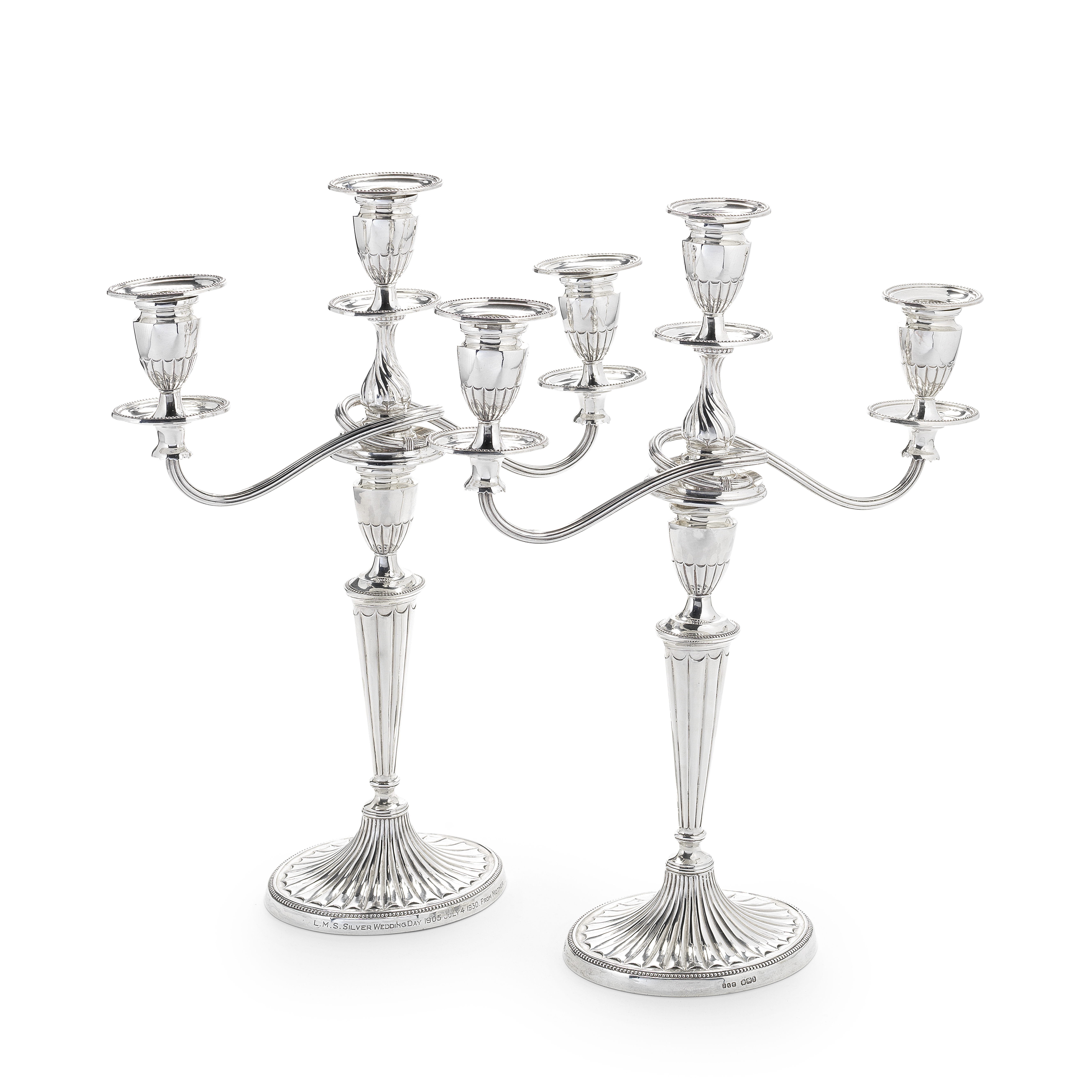 A pair of silver candlesticks with electroplated three-light branches Jenkins & Timm, Sheffield 1...