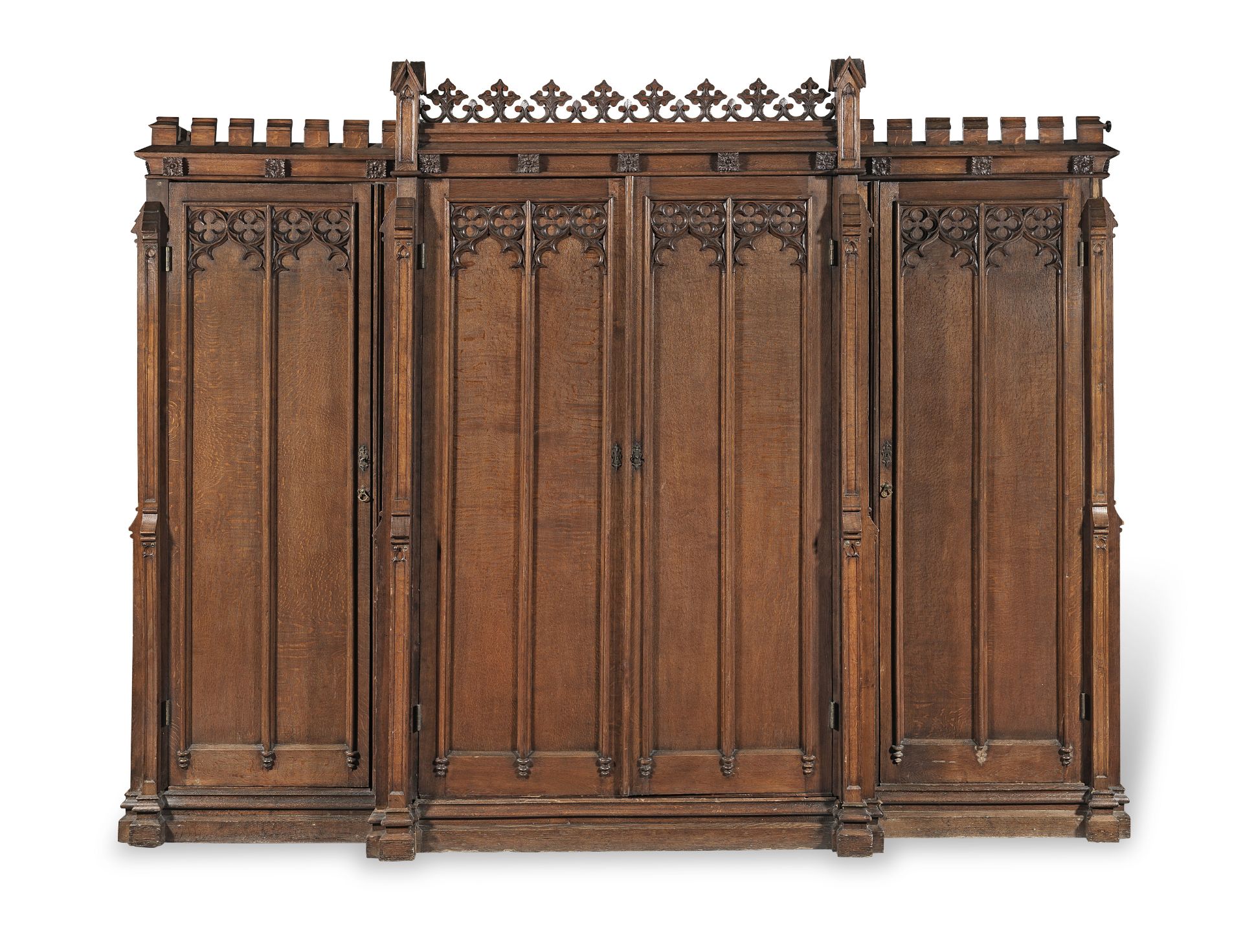 An early Victorian gothic revival oak breakfront wardrobe in the manner of Thomas King
