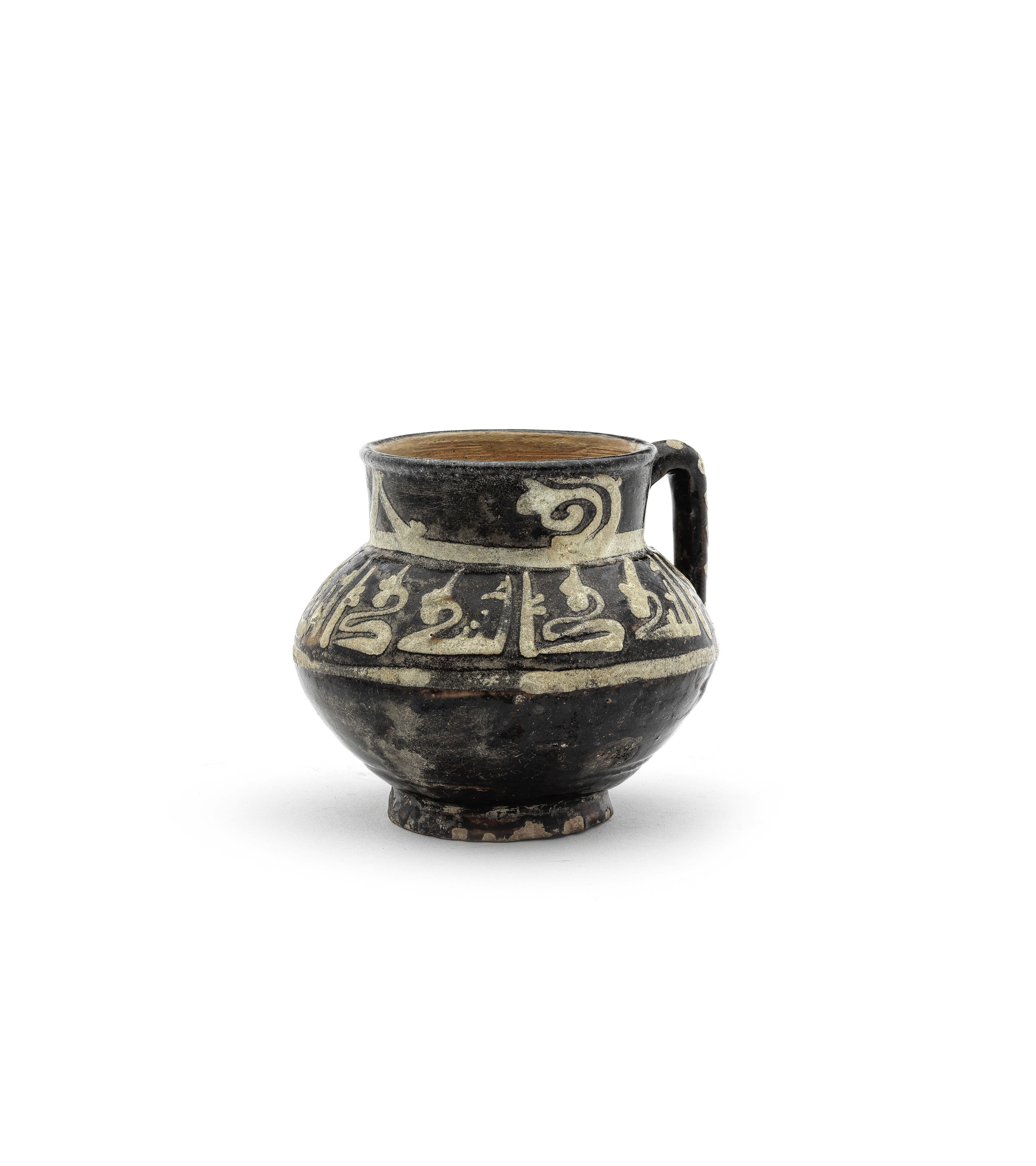 A slip-painted pottery mug Persia, 10th Century