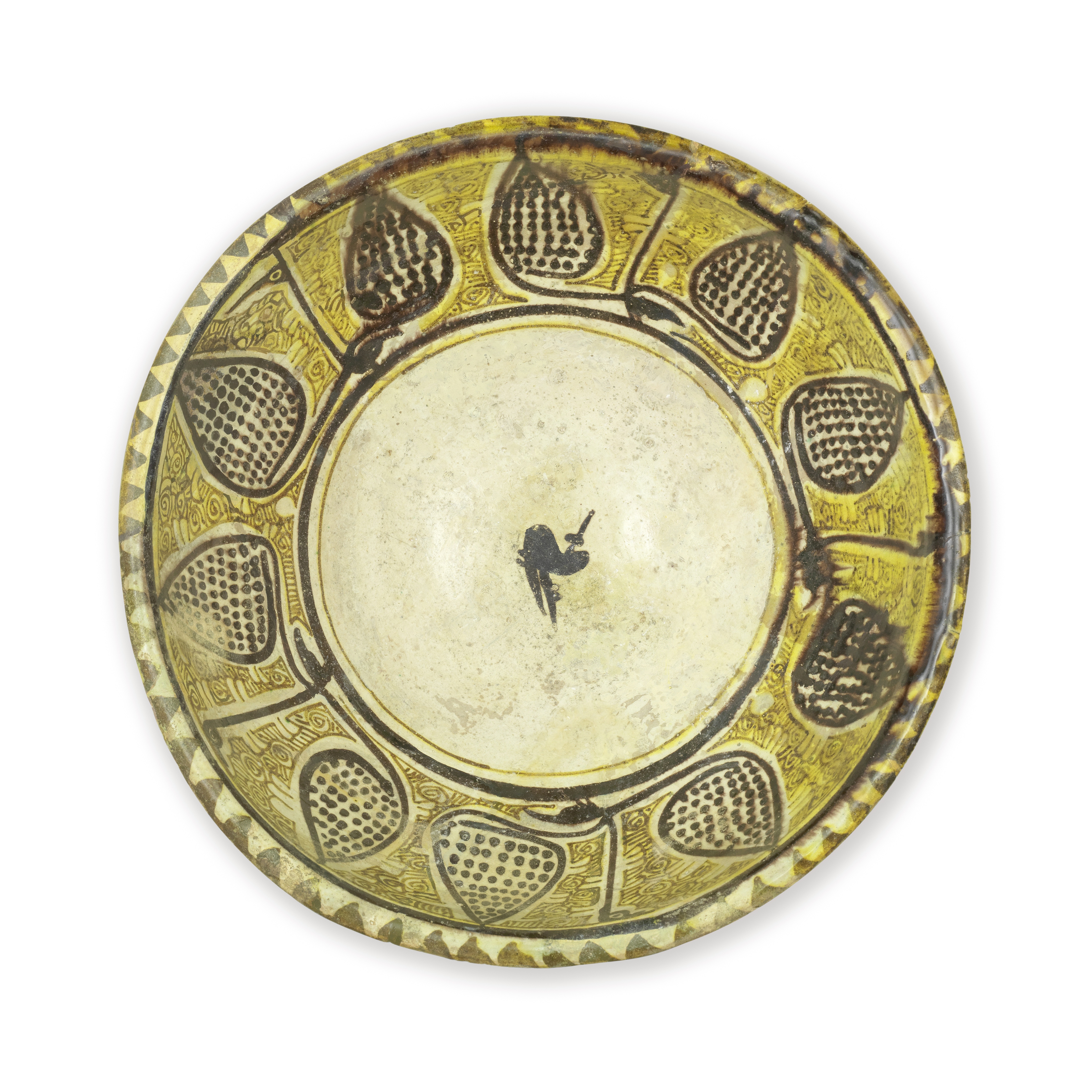 A large Nishapur 'yellow staining black' slip-painted pottery bowl Persia, 10th Century