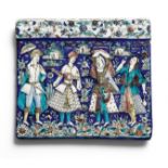 A Qajar moulded pottery tile depicting two youths with dancing maidens Persia, circa 1880