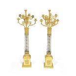 A pair of early 19th century gilt bronze and cut glass nine light candelabra Signed Thomire A Par...