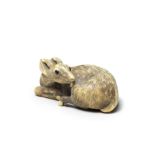 An ivory netsuke of a recumbent deer By Garaku, Osaka, Edo period (1615-1868), early 19th century