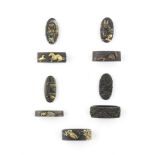 Four fuchi-gashira (hilt collars and pommels) and a fuchi (hilt collar) Edo period (1615-1868), 1...