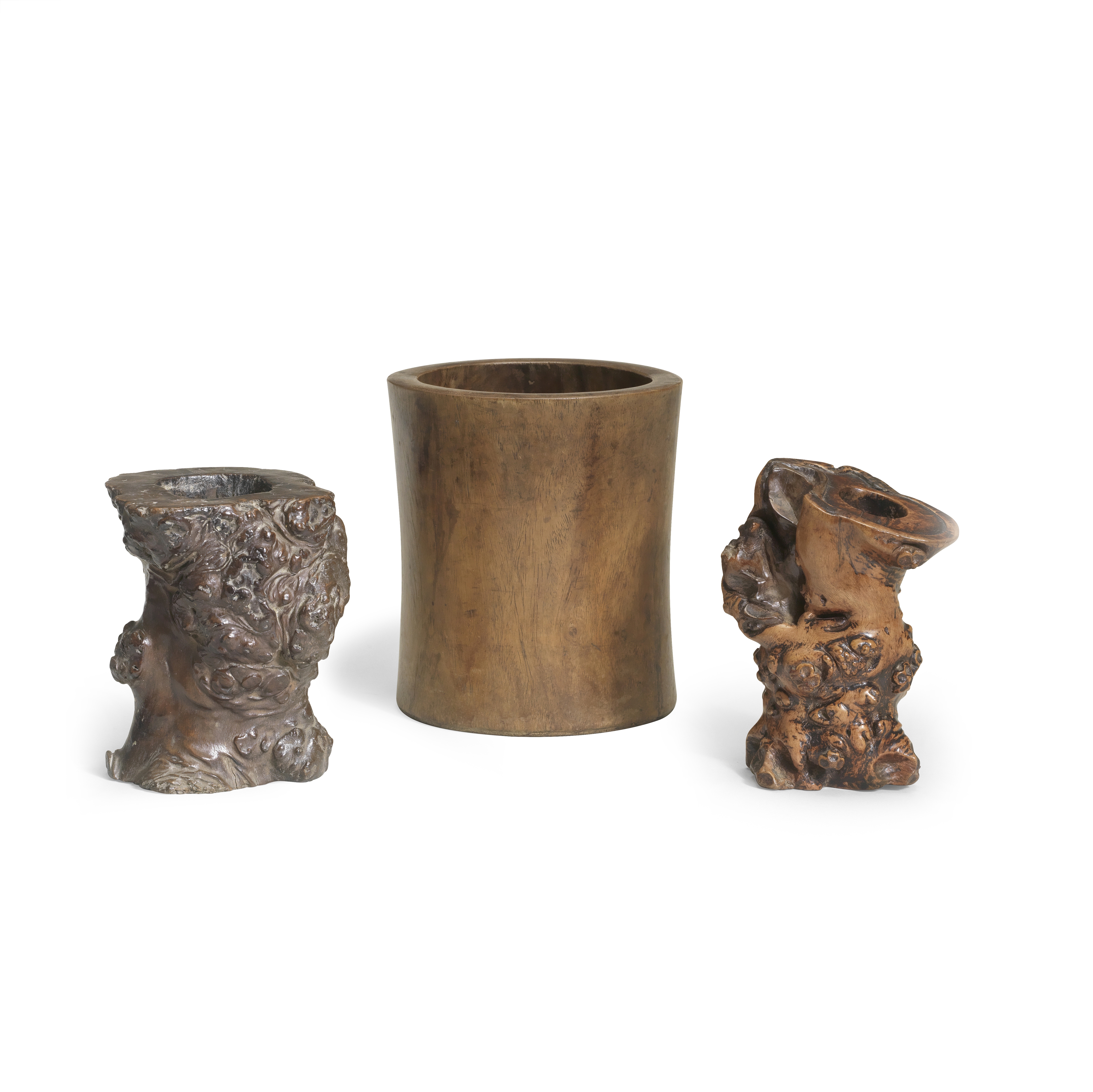 A HUANGHUALI BRUSHPOT AND TWO GNARLED ROOT WOOD BRUSHPOTS, BITONG 18th/19th century (3)