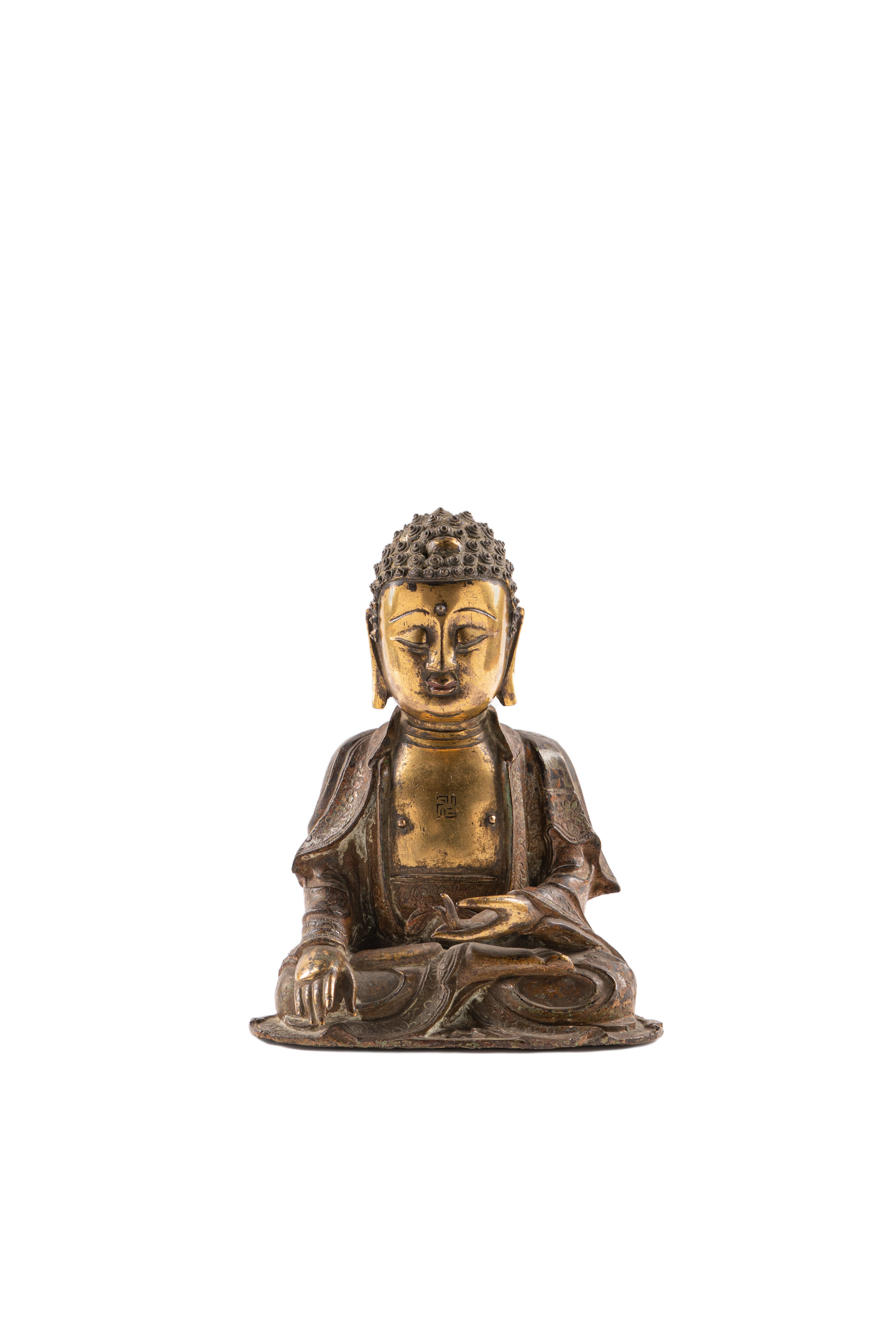 A PARCEL-GILT BRONZE FIGURE OF BUDDHA Ming Dynasty