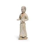 A PAINTED POTTERY FIGURE OF A FOREIGN GROOM Tang Dynasty