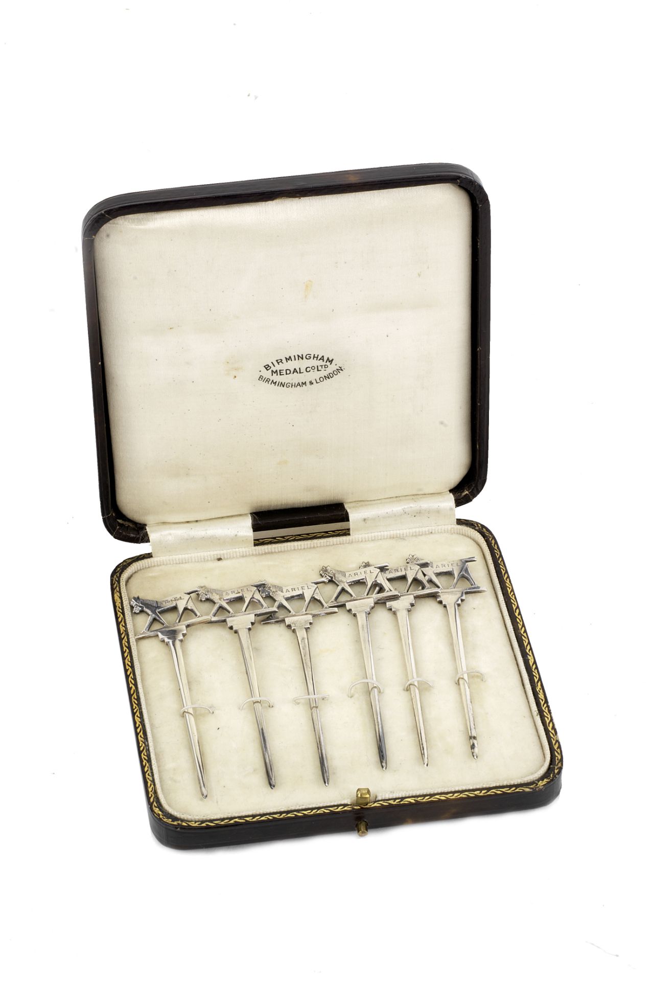 An Ariel Motorcycles souvenir leather-cased set of silver cocktail sticks, presented 1929,