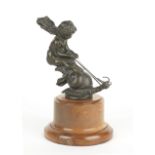 A rare and impressive 'L'Enfant &#224; l'Escargot' (Boy Riding Snail) bronze mascot by Eugene Gai...