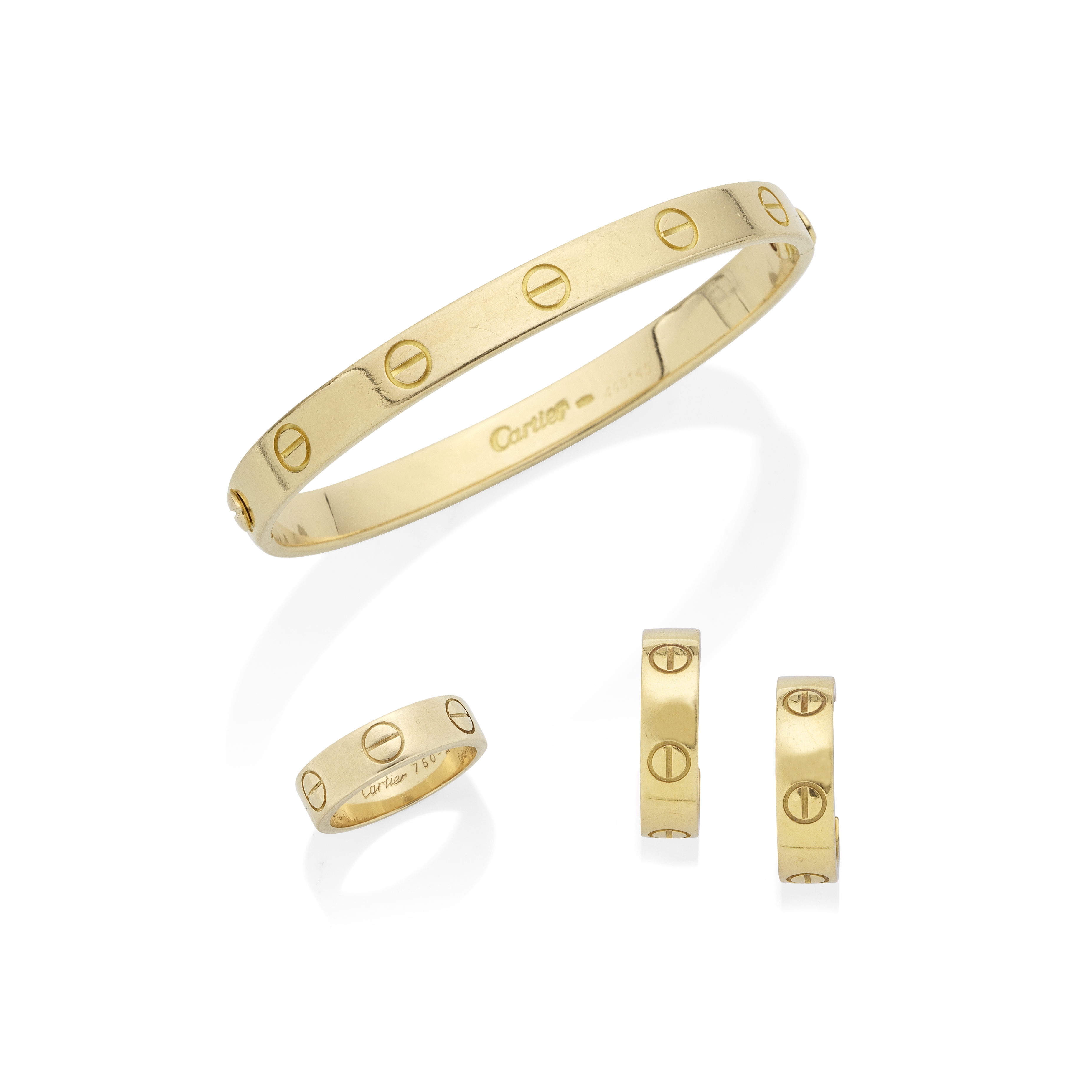 CARTIER: 'LOVE' BANGLE, EARRING AND RING SUITE (3)