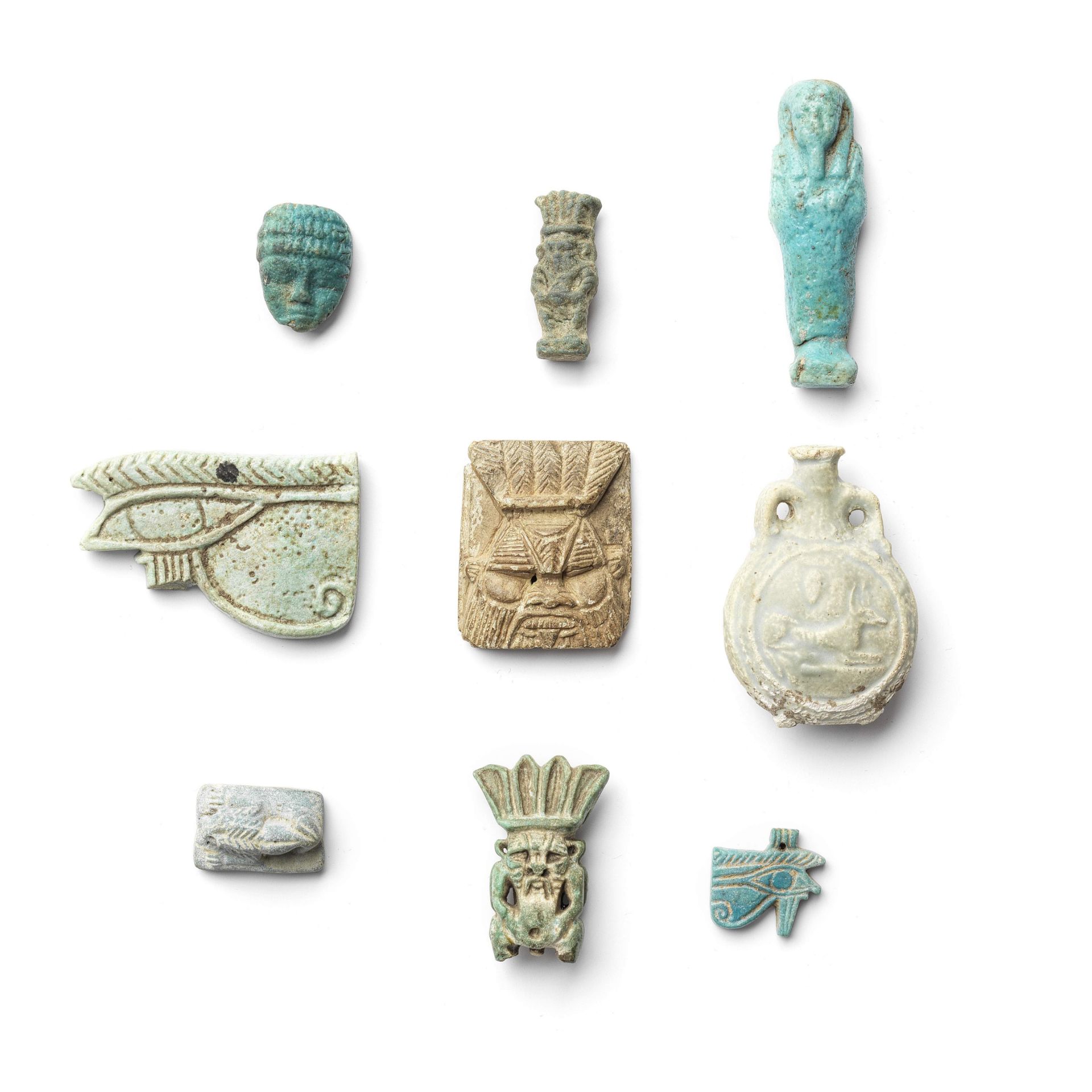 Eight Egyptian faience objects together with an Egyptian glazed steatite Bes plaque, 9