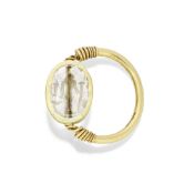 An Egyptian gold and rock crystal scarab ring