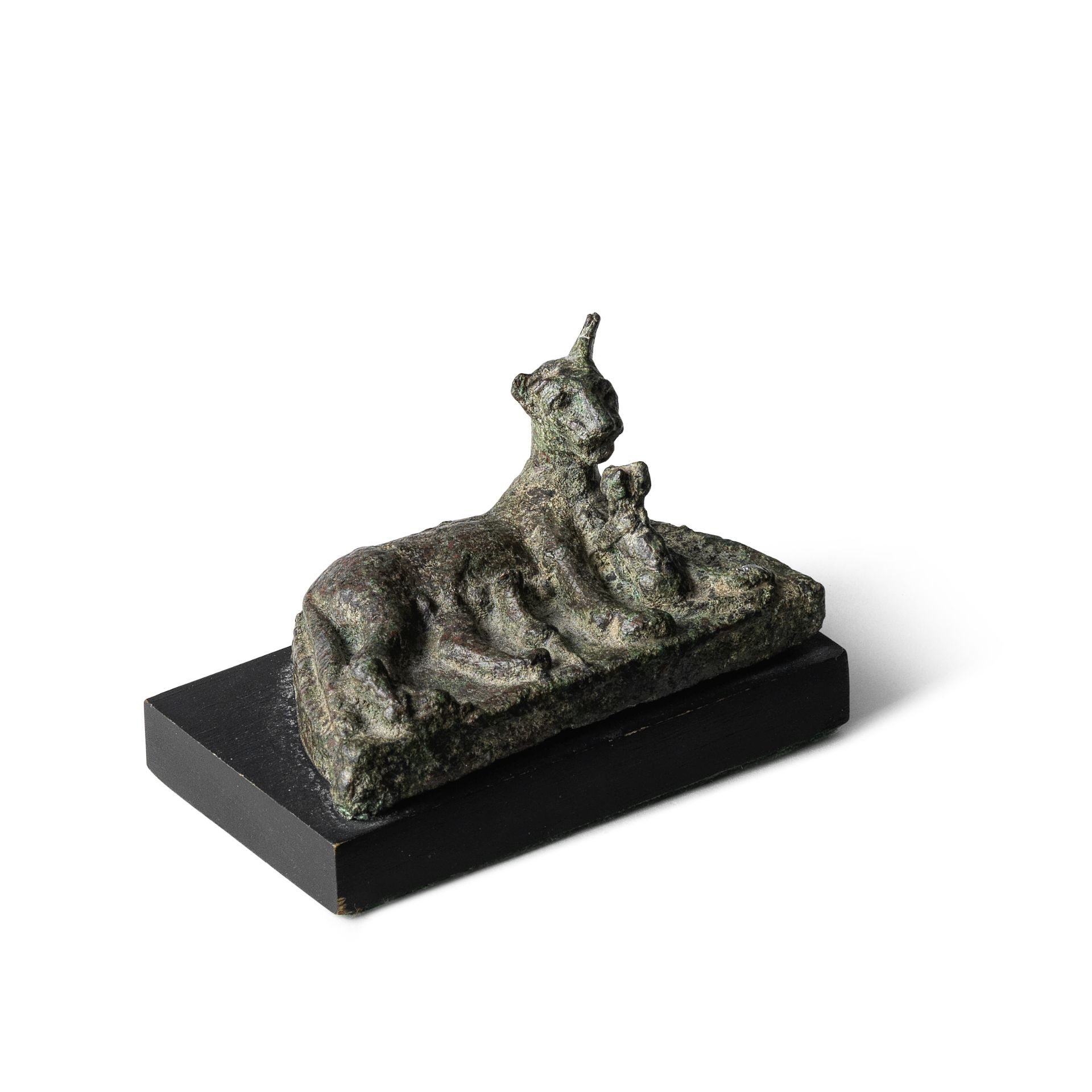 An Egyptian bronze cat with three kittens