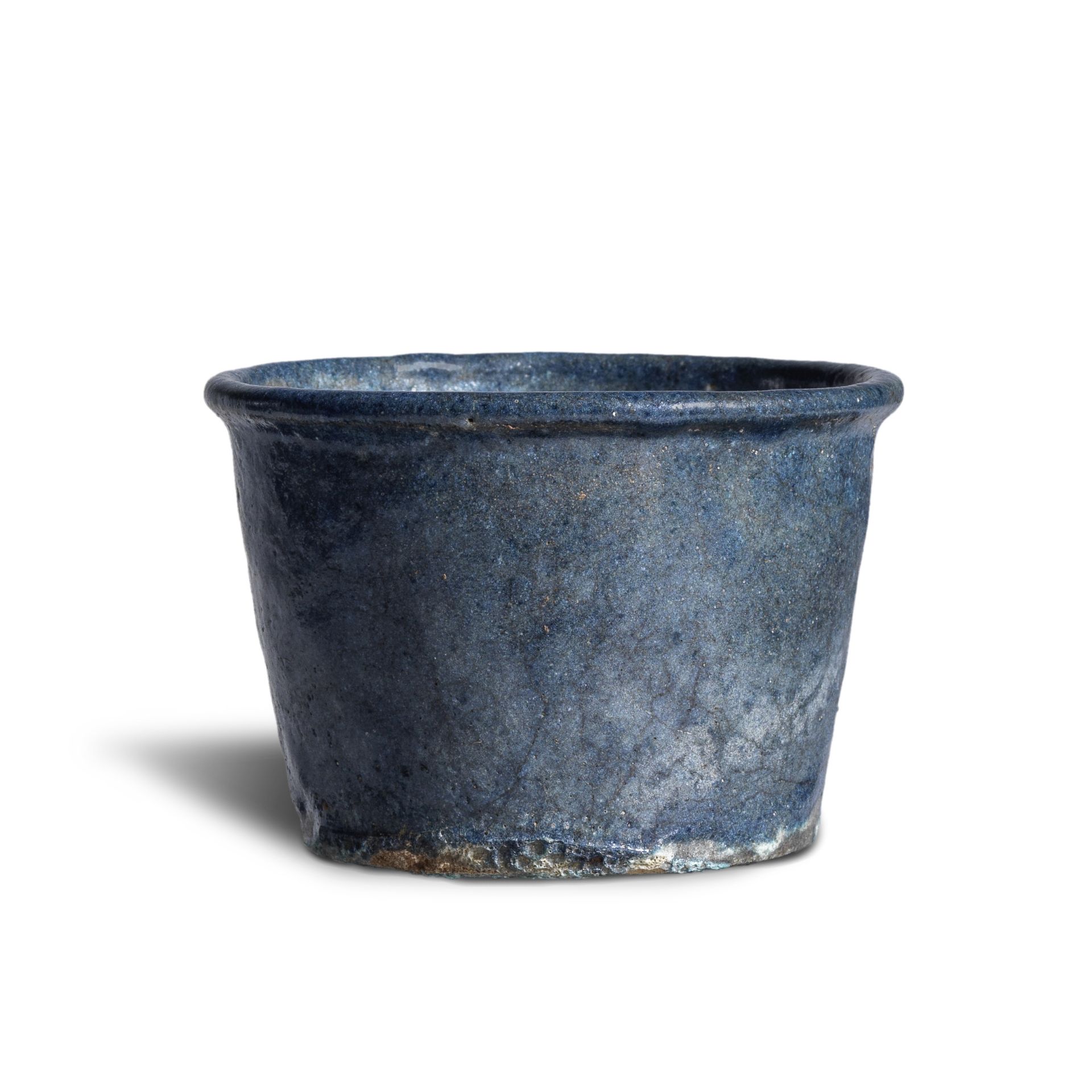 An Egyptian dark blue faience jar