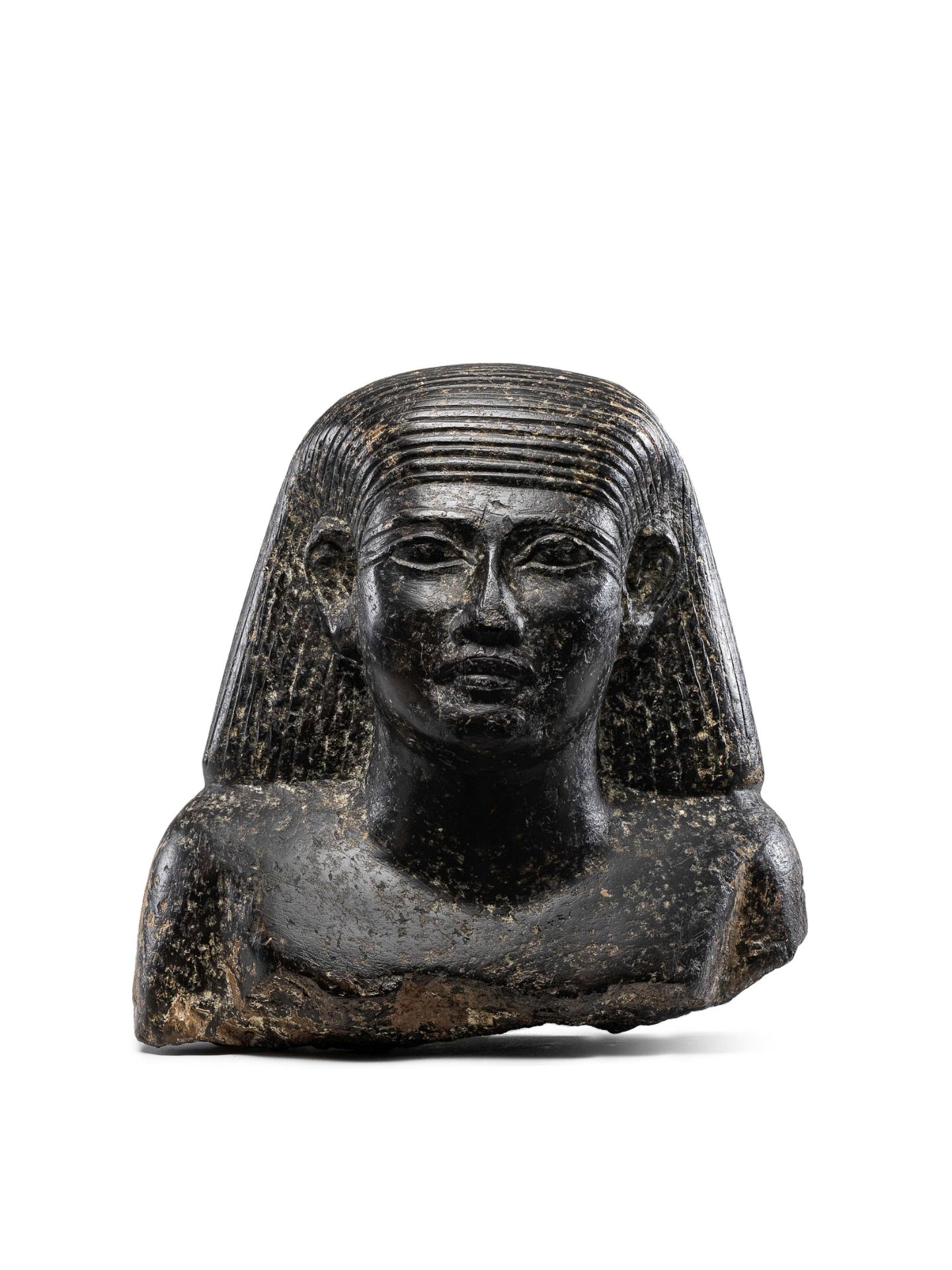 An Egyptian granite bust of an official