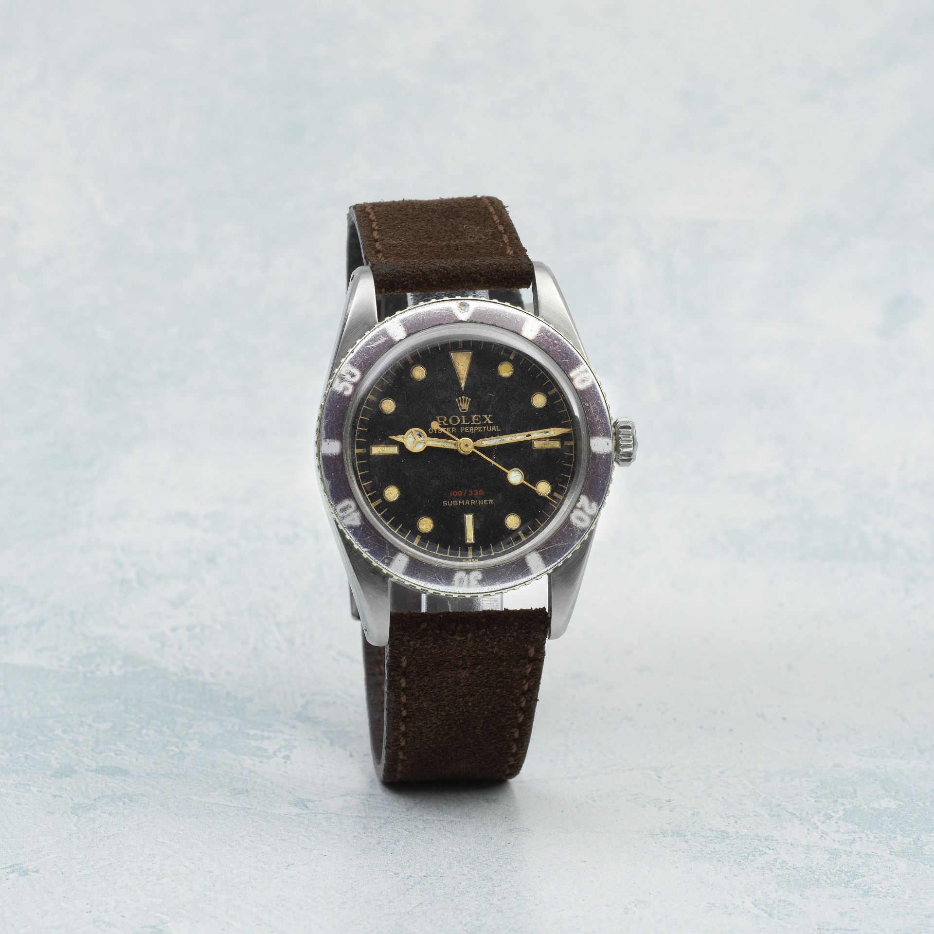Rolex. A fine and rare stainless steel automatic wristwatch with gilt dial and red depth rating ...