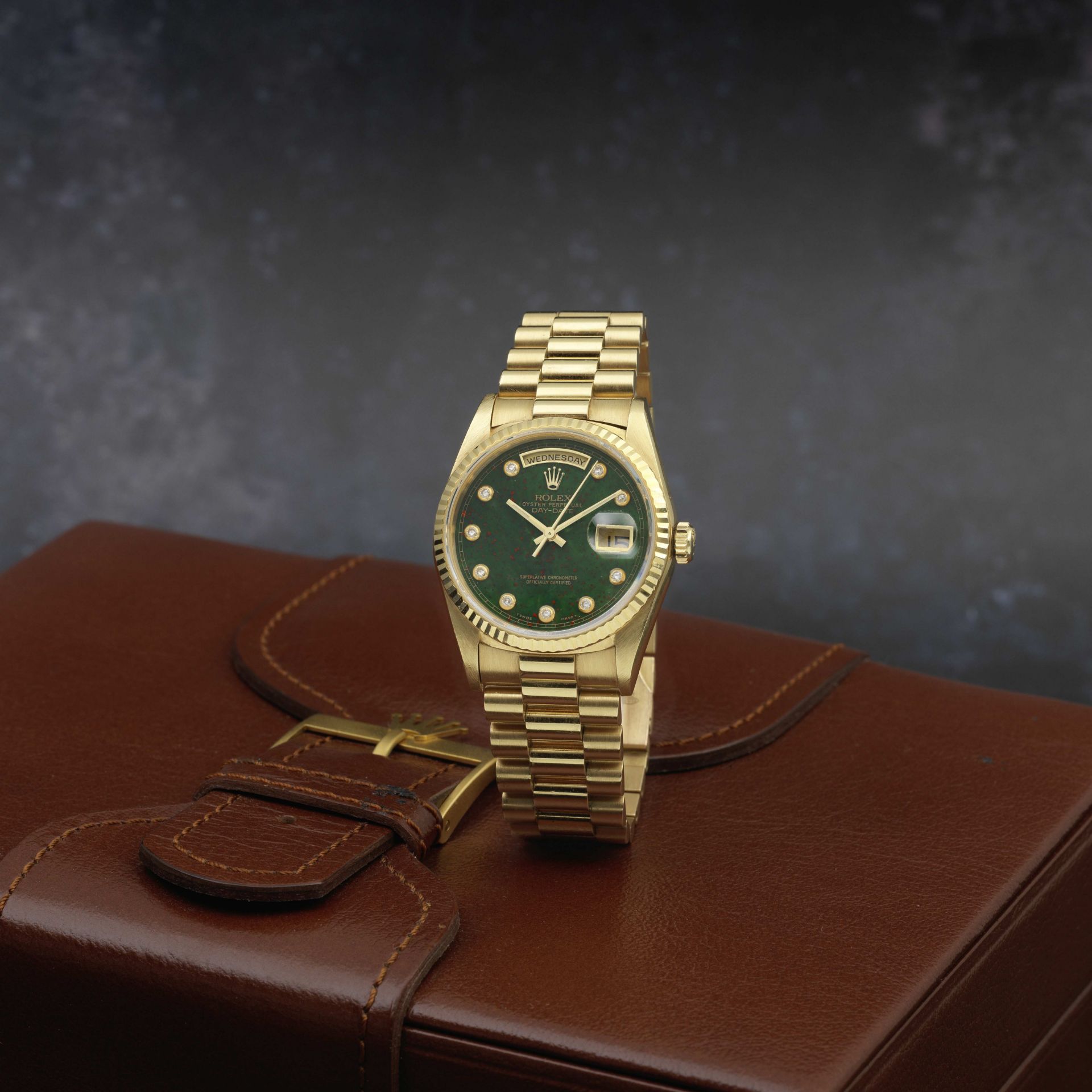 Rolex. A fine and rare 18K gold automatic calendar bracelet watch with diamond set bloodstone dia...