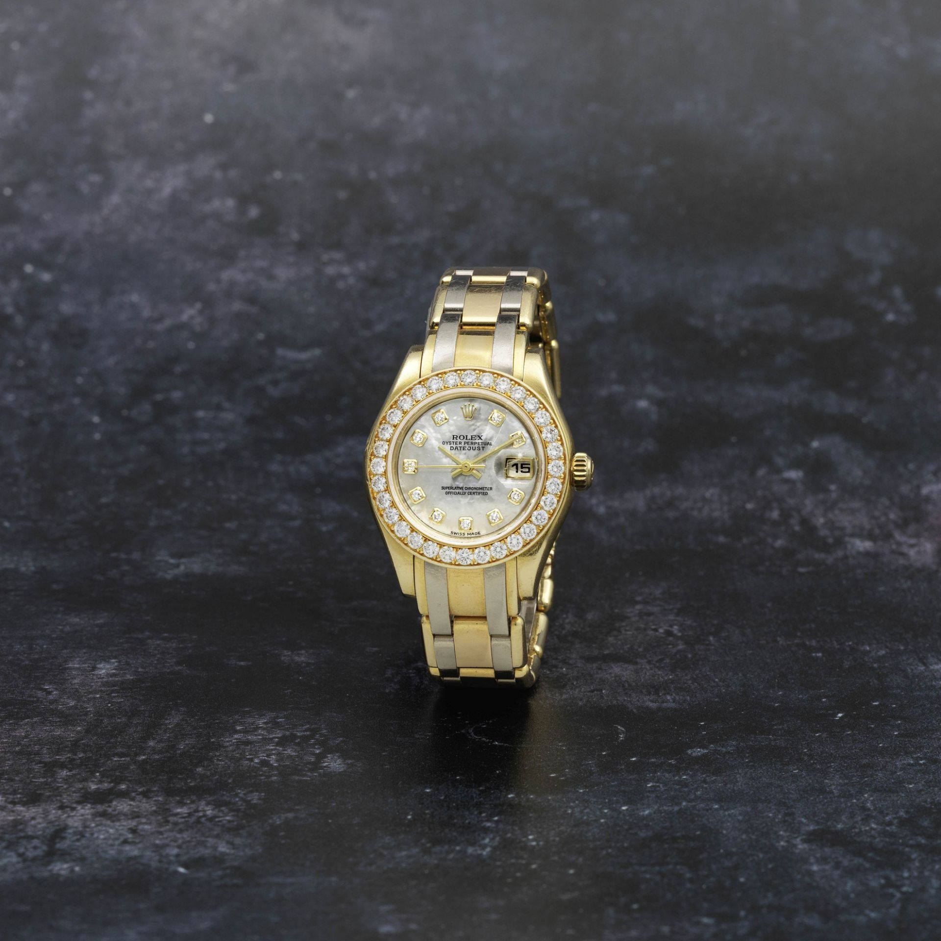 Rolex. A lady's 18K two colour gold and diamond set automatic calendar bracelet watch with diamon...