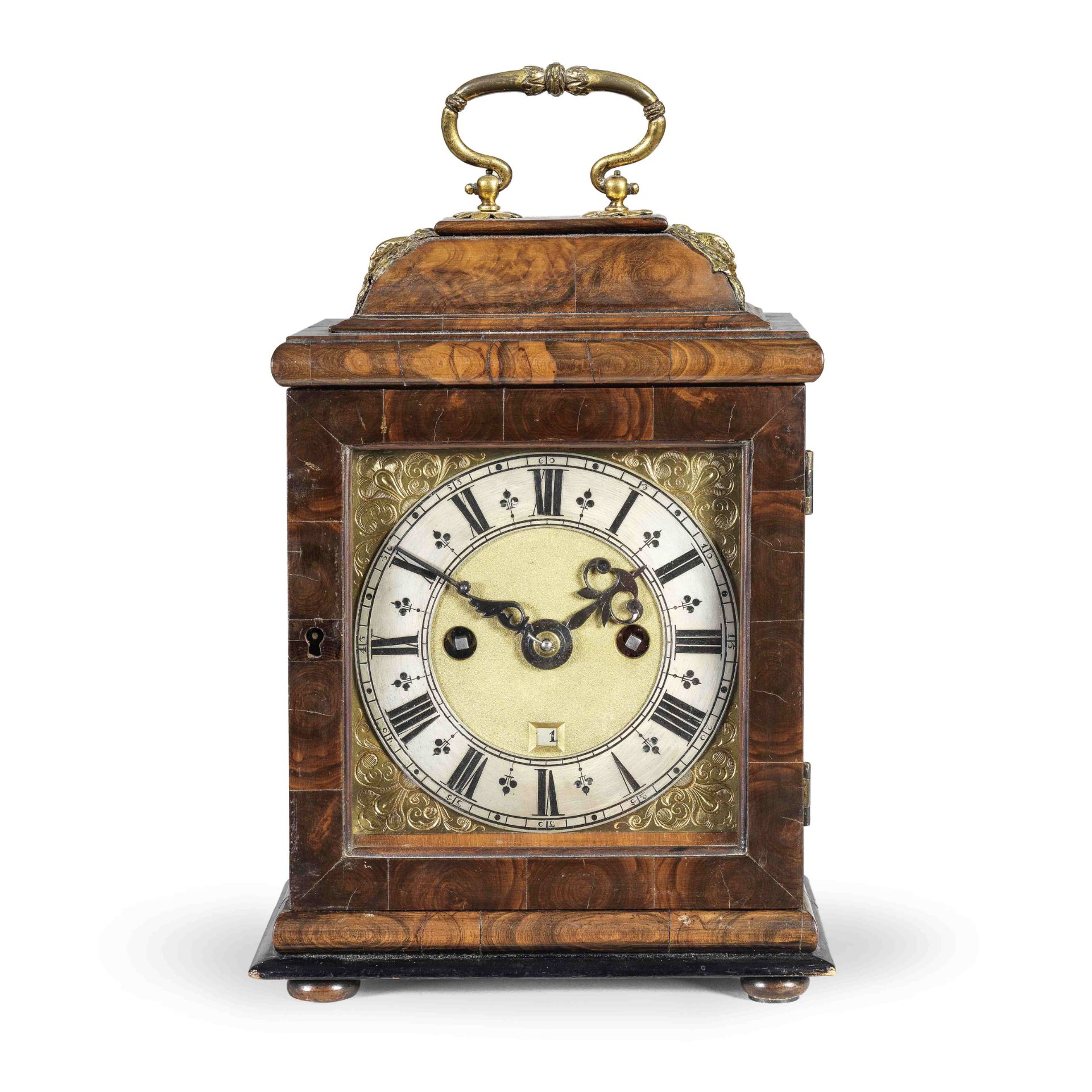 A miniature olive-wood veneered striking table clock The movement signed for Henricus Jones, Lond...
