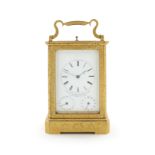 A fine and rare mid 19th century French engraved brass striking and repeating carriage clock with...