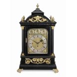 An impressive late 19th century quarter chiming ebonised table clock with deadbeat escapement and...