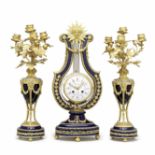 A 19th century porcelain ormolu and glass jewelled lyre clock garniture Howell & James Ltd, To th...